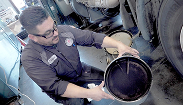 man inspecting DPF